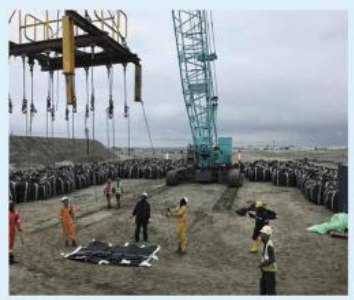 Crane lift during polder roadbed construction at Matarbari.
